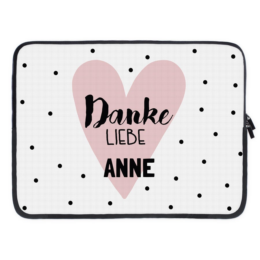 Bedruckte Laptoptasche mit rosa Herz, schwarzen Punkten und dem Text "Danke liebe Anne"
