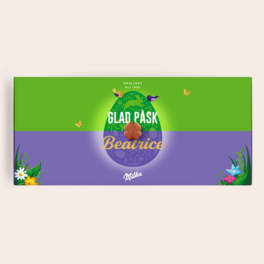 Personliga Milka presentförpackning - Påsk Personlig Say it with Milka-chokladpresentförpackning med texten "Glad Påsk Beatrice" och blommor, tryckt med namn.