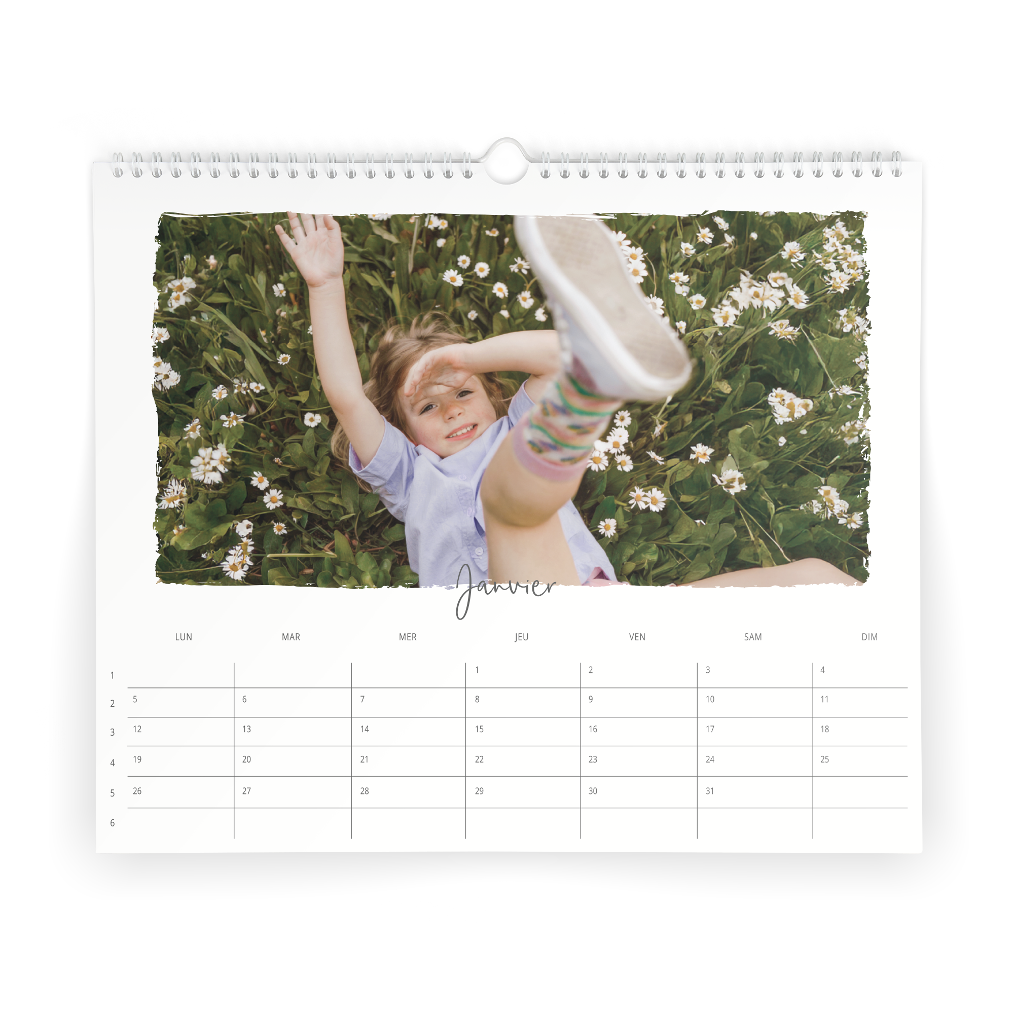 Calendrier personnalisé imprimé avec la photo d'un enfant souriant pour commencer 2026.