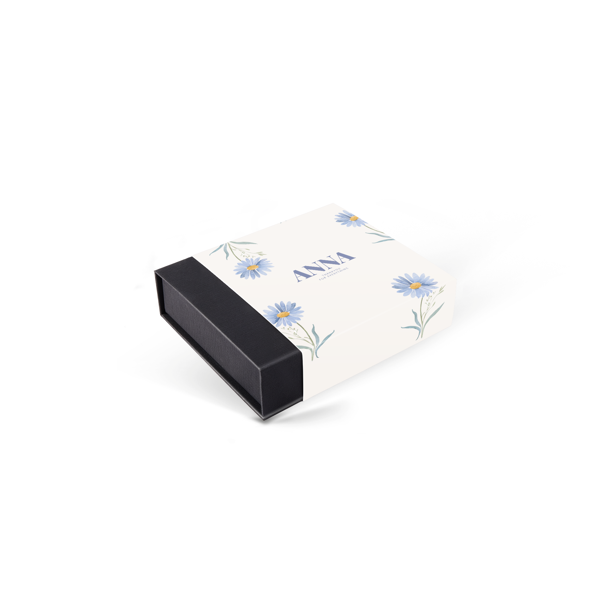Personoidut deluxe-suklaat mustassa laatikossa, joissa on painettu nimi "ANNA" ja kukkakuviointi.