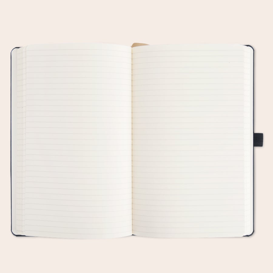 Father's Day notebook Open Father's Day notebook with lined pages and a pen holder. This personal Father's Day notebook is ready for custom engraving.