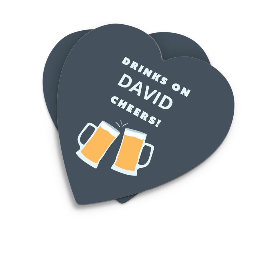 Coasters Heart-shaped personalized coasters printed with the text Drinks on David Cheers and two beer mugs