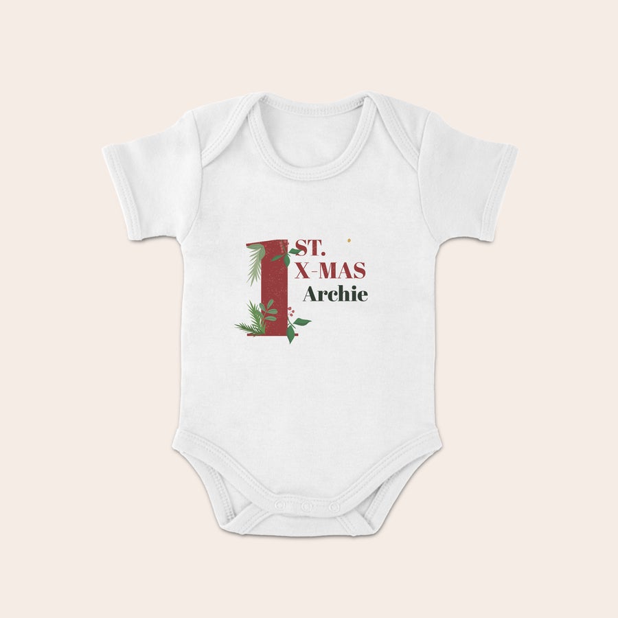Baby's first Christmas Babygrow White Christmas babygrow with name Archie, printed with a festive number one for First Christmas.