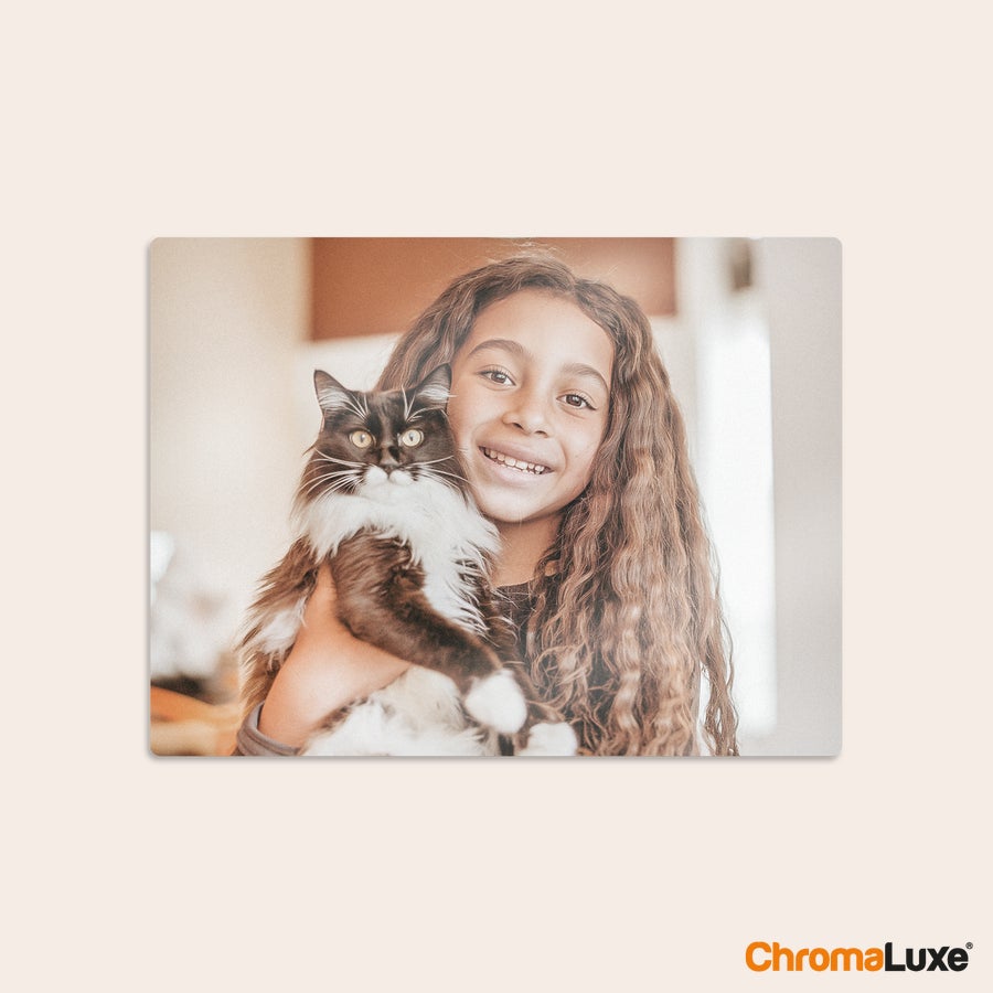 Aluminium photo panel Chromaluxe aluminium photo print of a girl smiling and holding a black and white cat