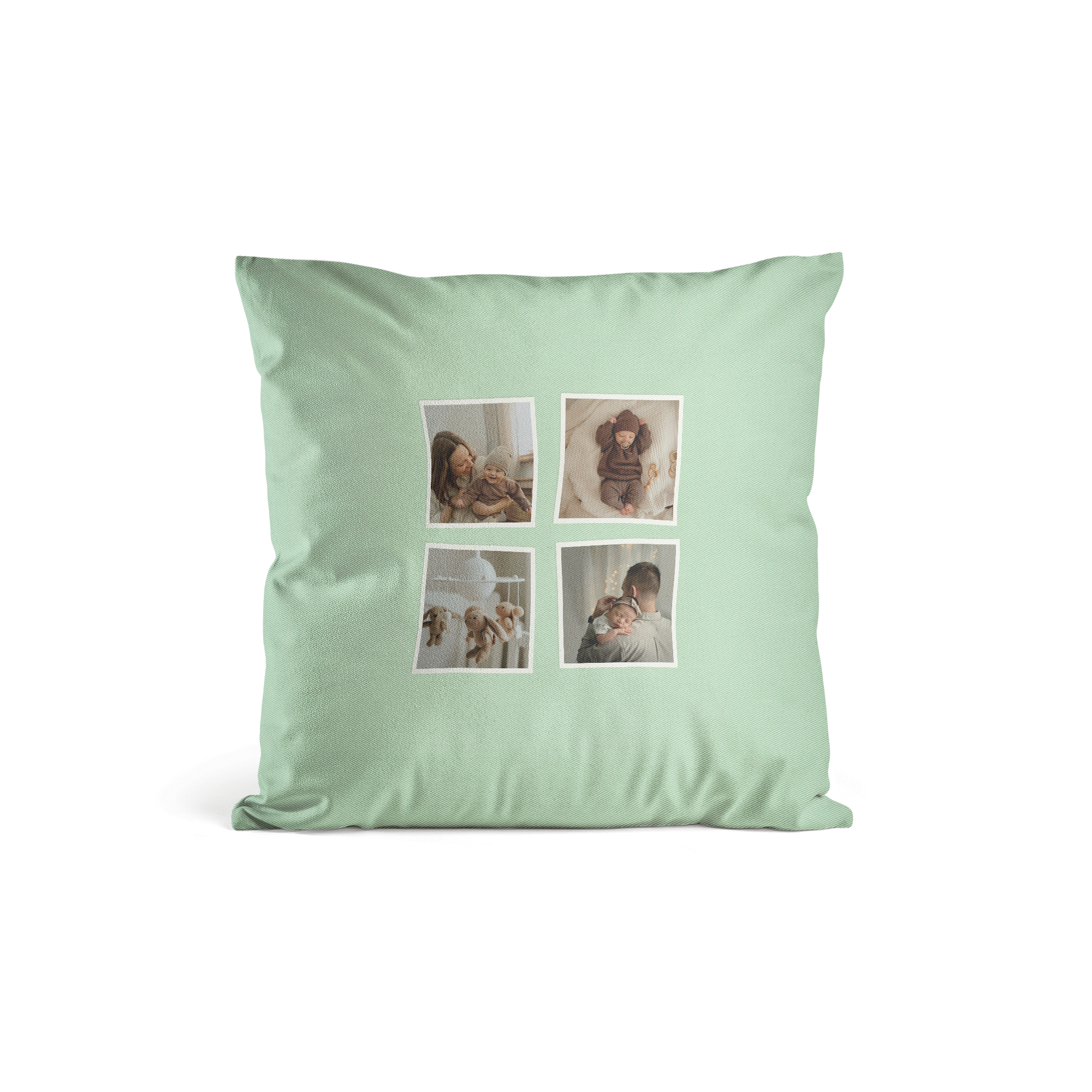 Mintgrønn pute med fire trykte bilder som viser en mor med baby, en sovende baby og en far som holder en baby, perfekt for å forvandle enhver plass.