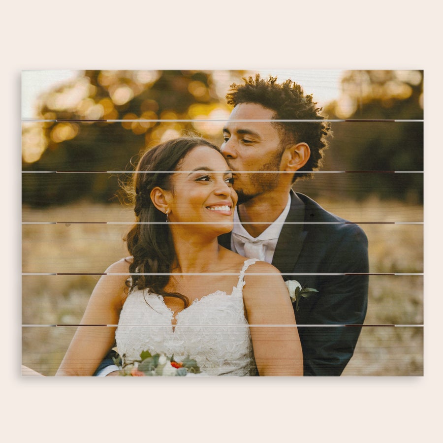 Photo on wood Personalized photo printed onto wooden planks showing a couple in a warm outdoor setting