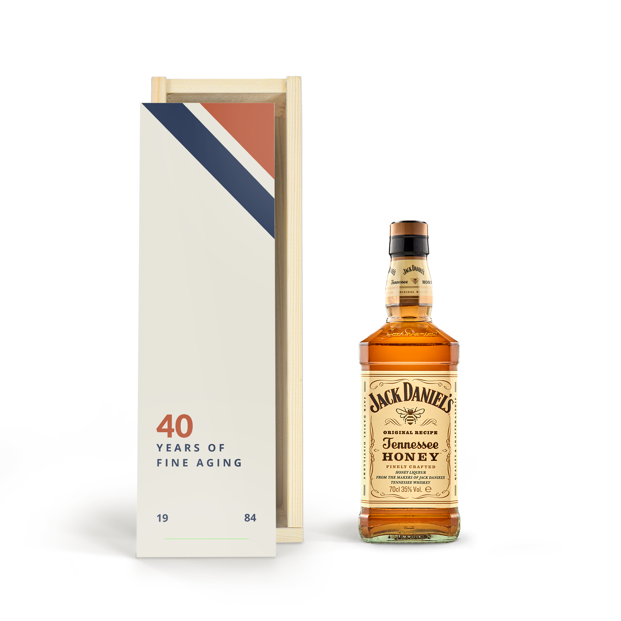 Fles Jack Daniels Tennessee Honey in bedrukte houten kist met de tekst 40 years of fine aging en de jaren 1984.