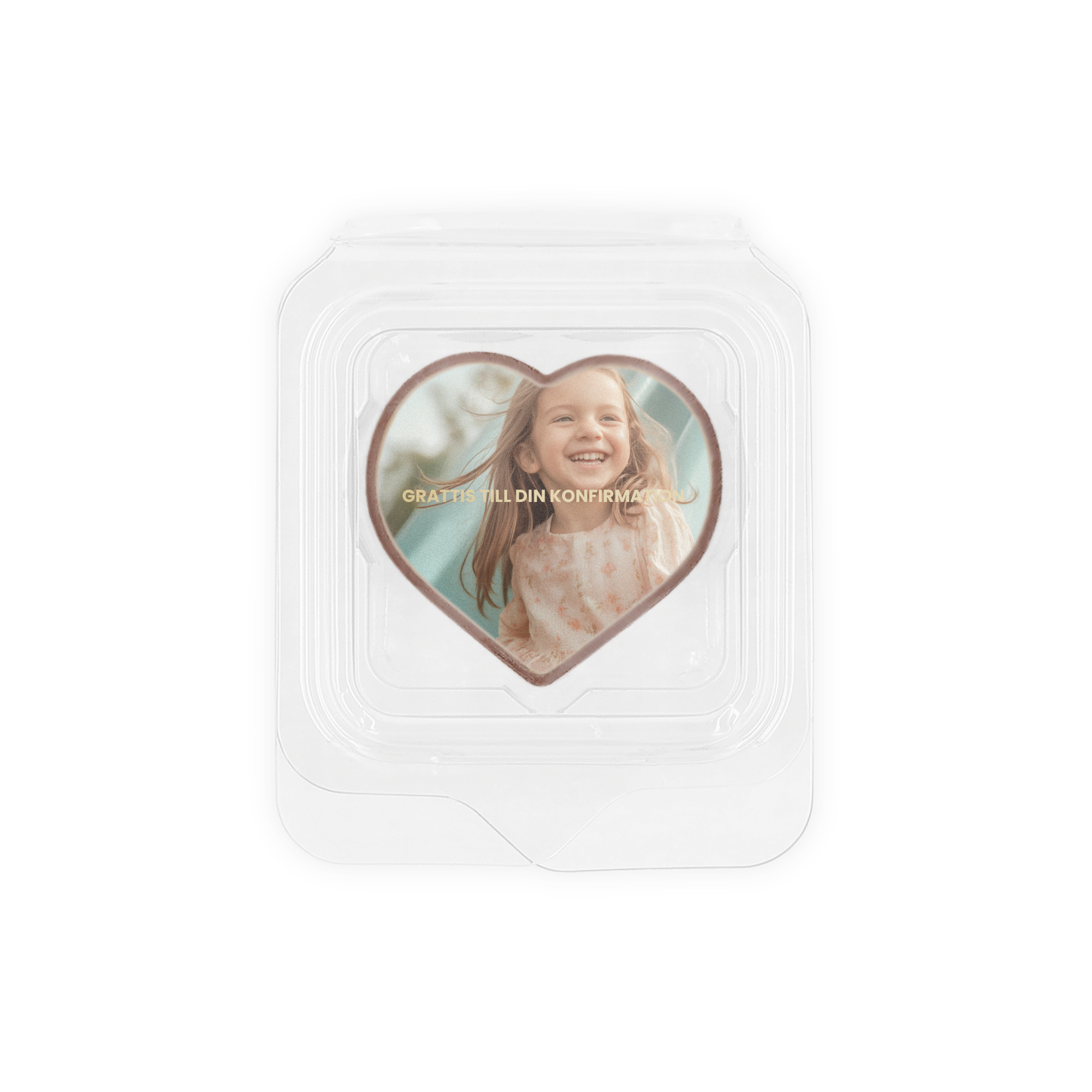 De godaste pralinerna med foto av en flicka och texten "Grattis till din konfirmation" tryckt på hjärtformad pralin