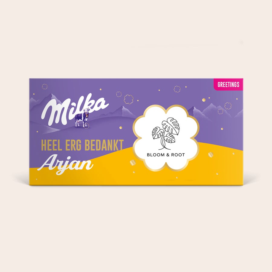 Gepersonaliseerde Milka reep - Hazelnoot Gepersonaliseerde Milka reep - Gebroken noten. Een paarse Milka reep met tekst 'Heel erg bedankt Arjan' en logo 'Bloom & Root'.