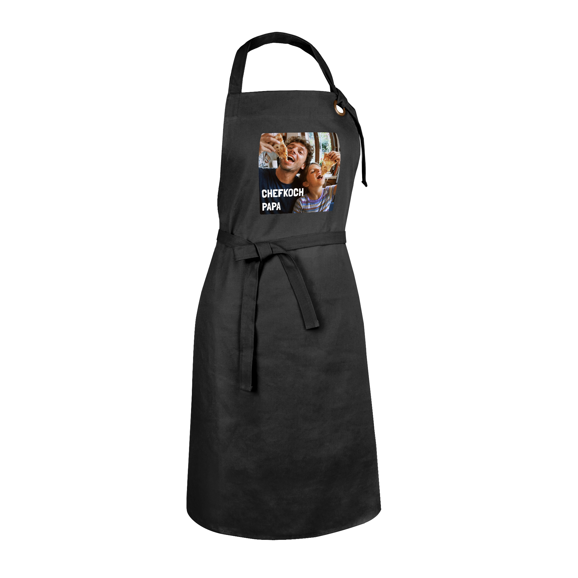 Schwarze Kochschürze bedruckt mit Foto von Vater und Kind beim Pizzaessen und dem Text CHEFKOCH PAPA.