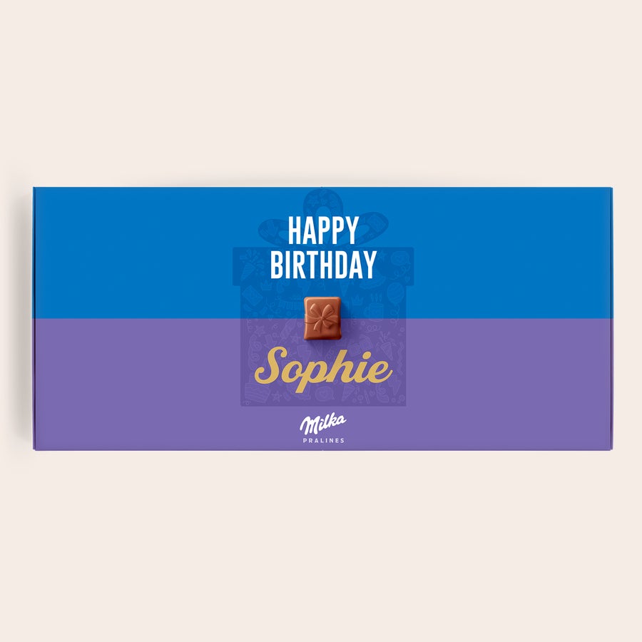 Milka Praliné Születésnap Személyre szabott Milka születésnapi díszdoboz Sophie névvel és Happy Birthday felirattal, ajándék alakú pralinéval díszítve.