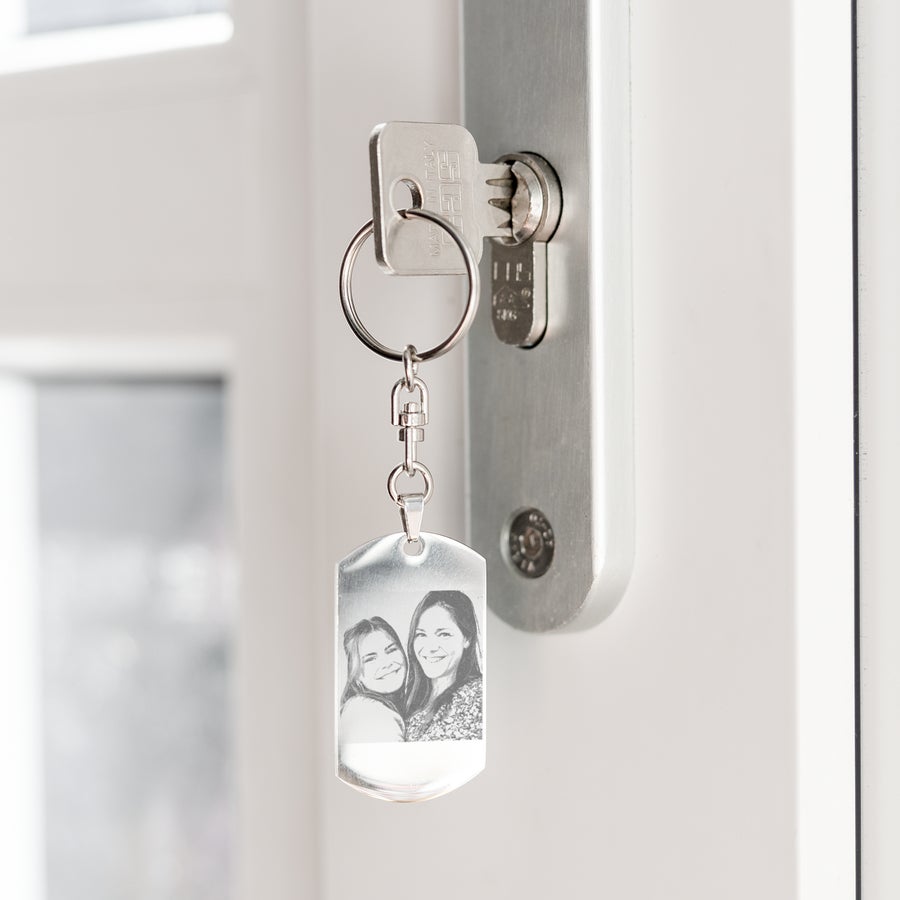 Engraved keyring Personalized photo keyring engraved with two smiling women hanging from a door key