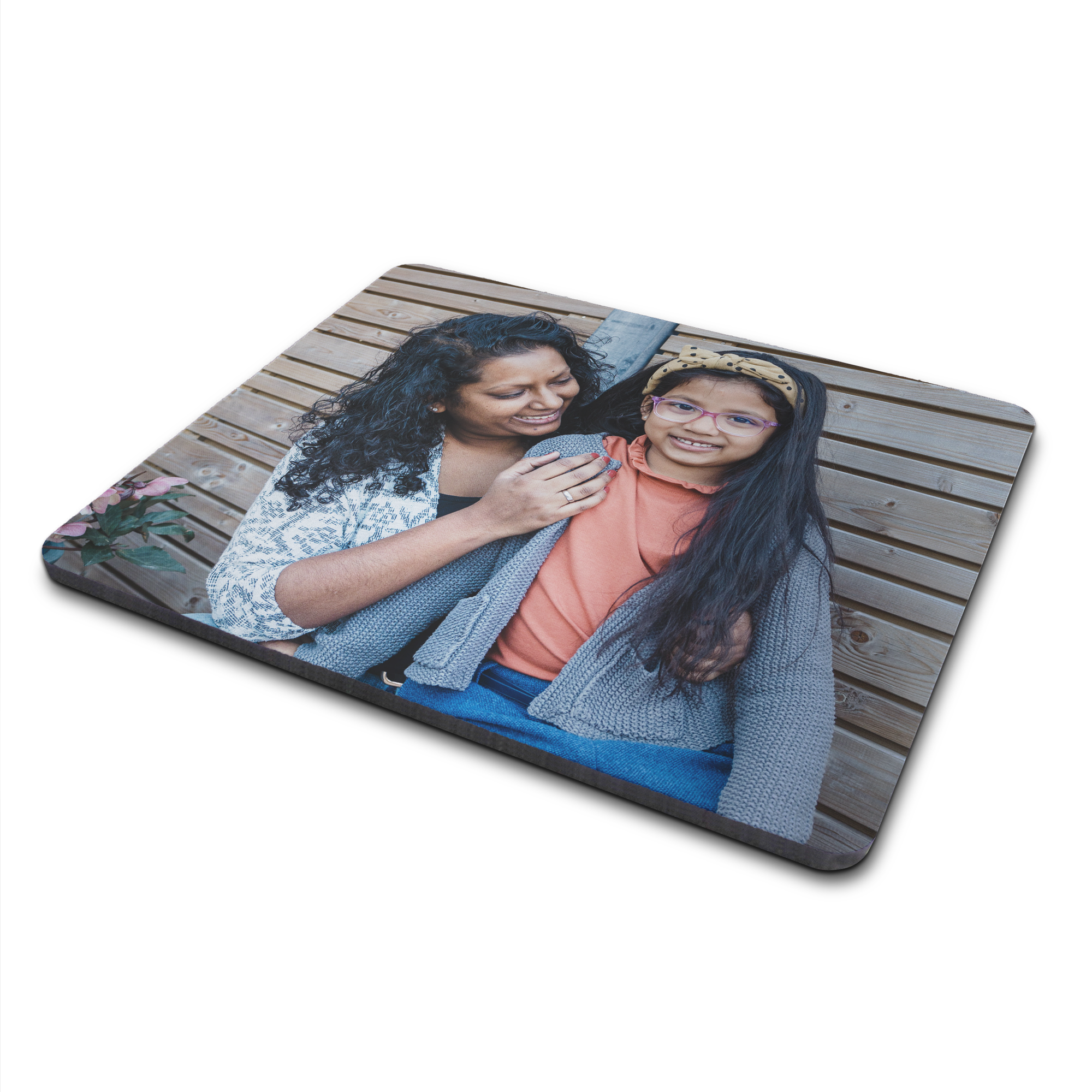 Rectangular personalized photo mouse mat printed with a mother and daughter smiling on a wooden background.