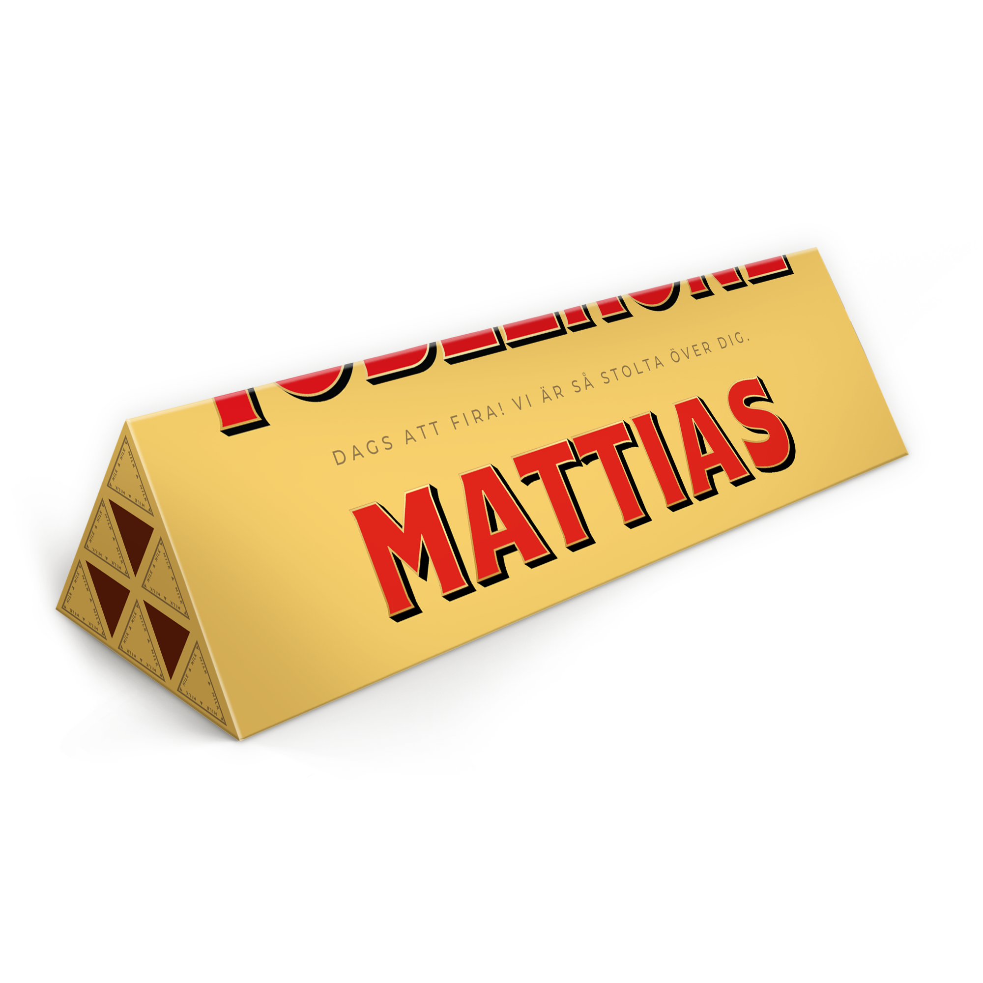 Personlig Toblerone-kaka - 1800 gram med Mattias namn och meddelandet Dags att fira! Vi är så stolta över dig. tryckt på förpackningen.