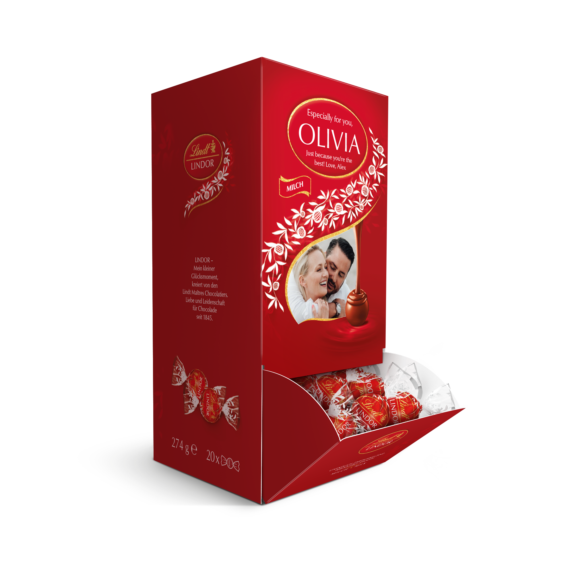 Červená darčeková krabička Lindt s vlastnou potlačou "Especially for you, OLIVIA, Just because you're the best! Love, Alex" a fotkou páru, obsahuje mliečne čokolády. Prekvapte ich personalizovanou čokoládovou darčekovou krabičkou Lindt.