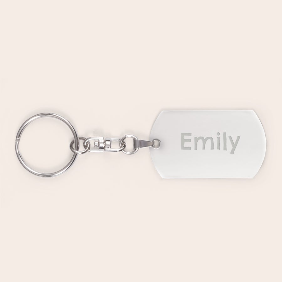 Engraved keyring White dog tag key ring with the name Emily engraved, attached to a silver-tone metal ring, perfect so you will lose your keys never again.