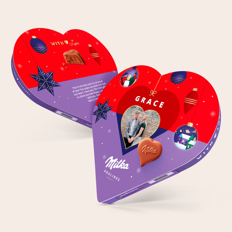 Corazón de Navidad Milka con nombre y foto Corazón Milka personalizado, con caja violeta y roja que muestra una foto de pareja y el nombre "GRACE", impreso con diseño navideño.