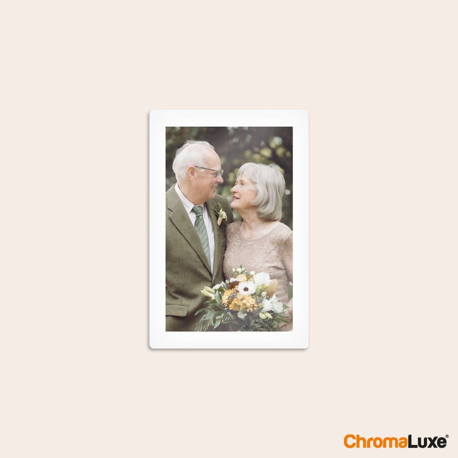 Aluminium photo panel Vertical Chromaluxe aluminium photo print showing a smiling elderly couple with a floral bouquet.