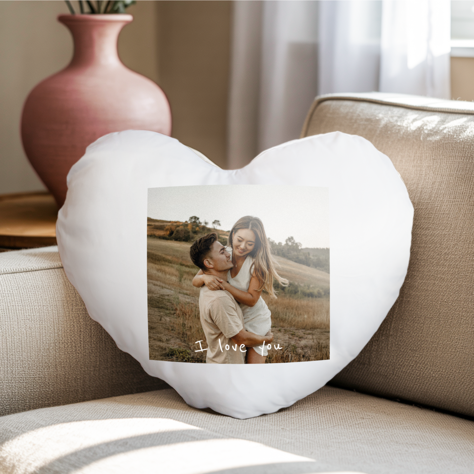 White heart shaped cushion printed with a photo of a couple and the text "I love you"