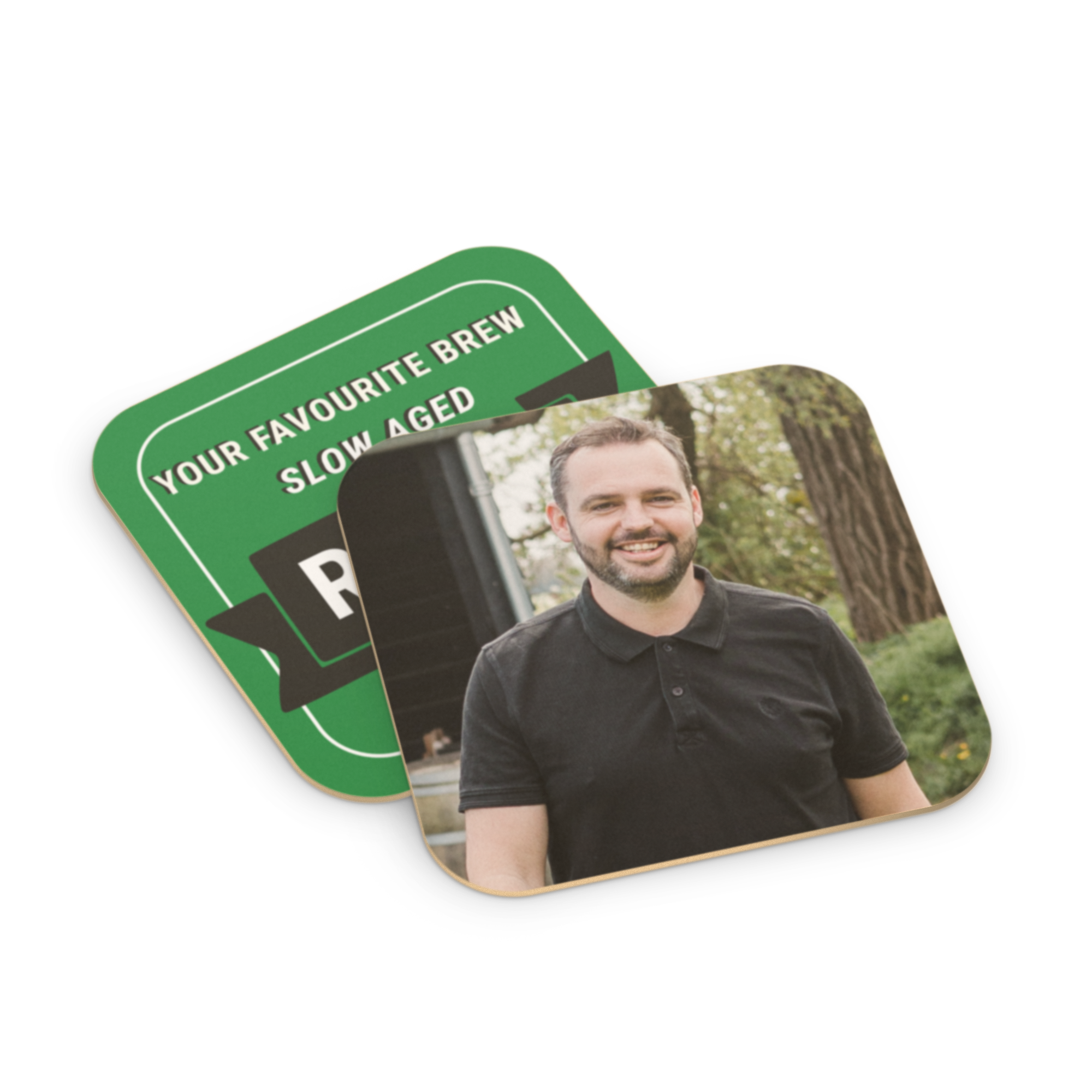 Custom printed beer coasters, one with a photo of a man smiling and another green with "YOUR FAVORITE BREW SLOW AGED"