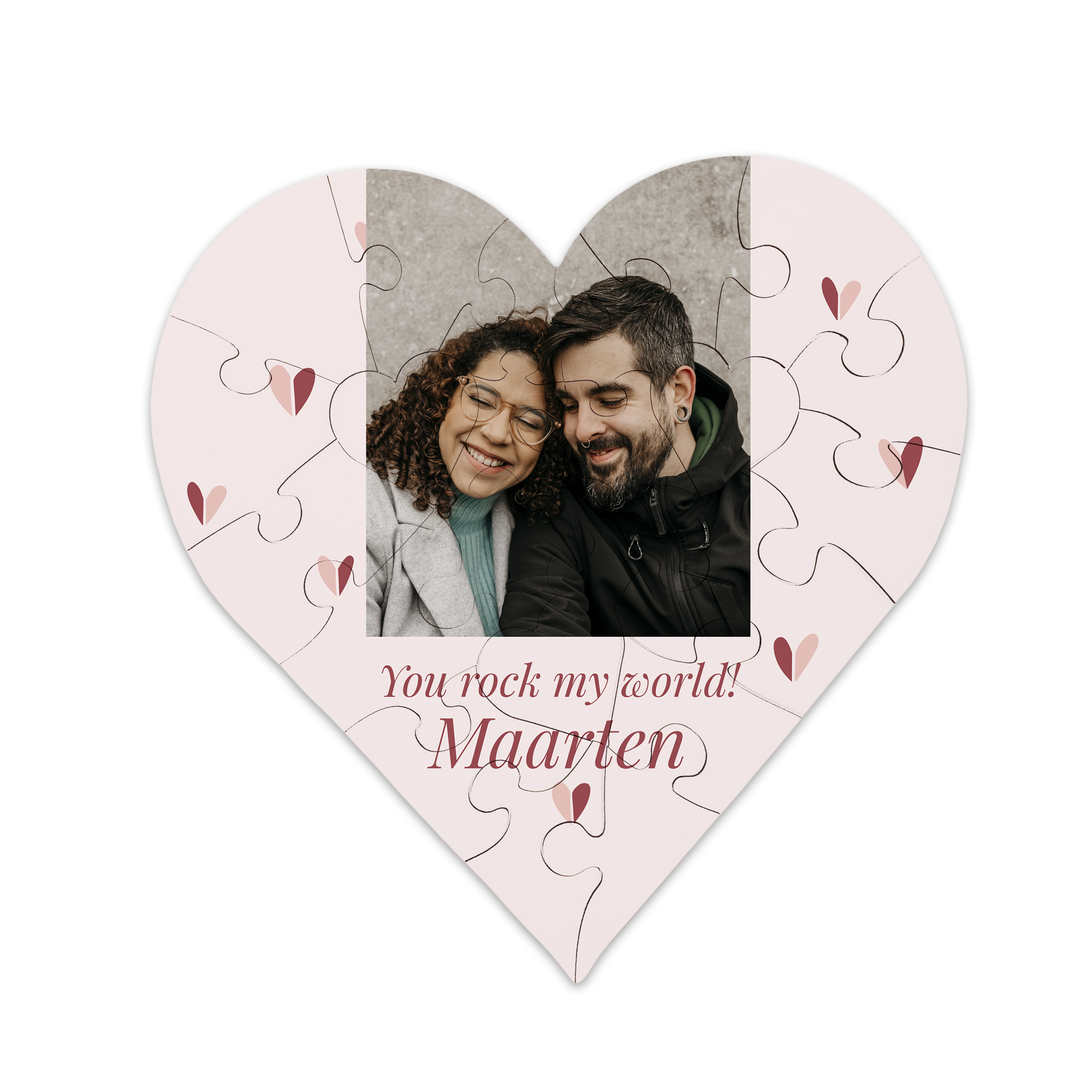 Hartvormige puzzel bedrukt met een foto van een stel, de tekst 'You rock my world!' en de naam Maarten, een uniek cadeau.