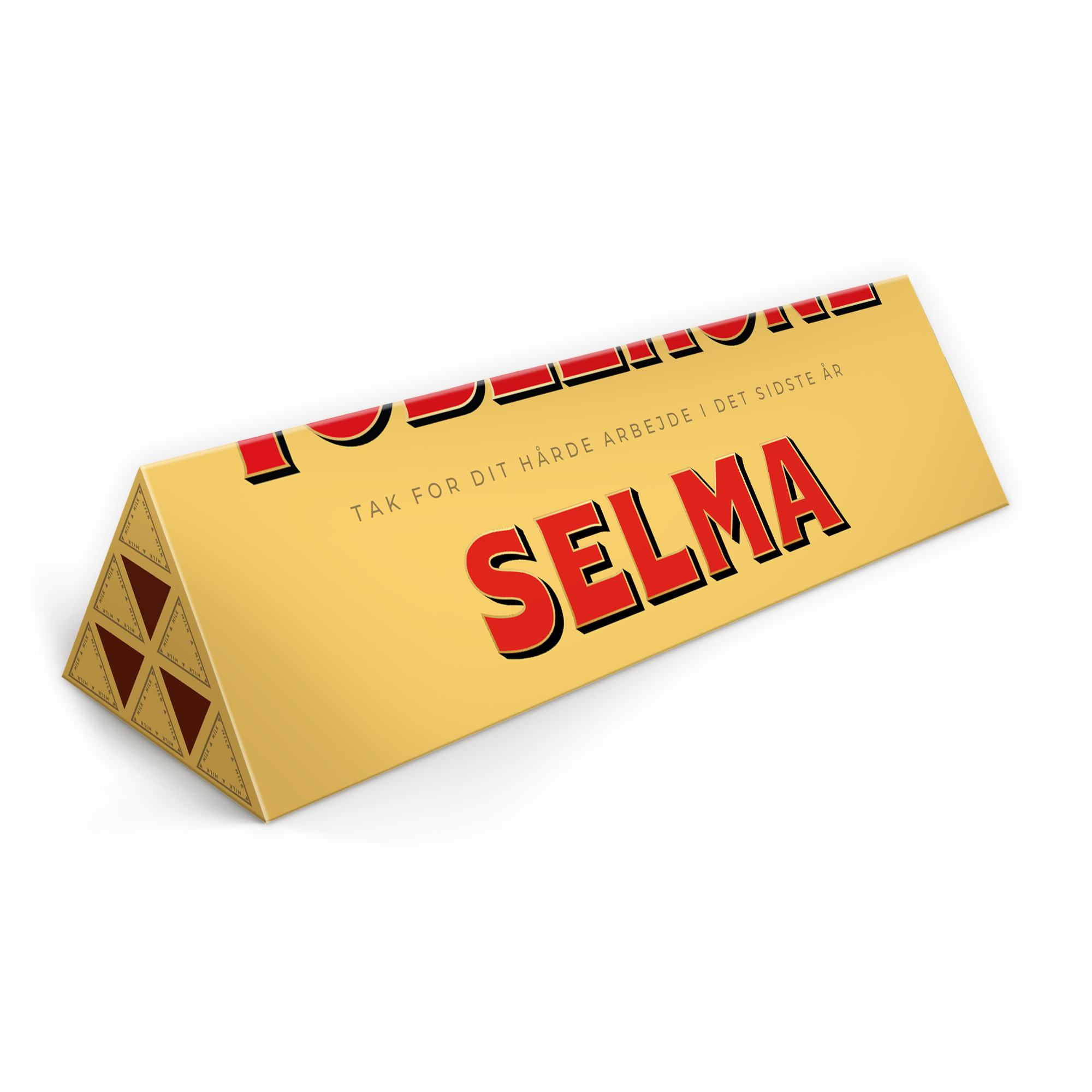 Personlig Toblerone-bar - 1800 gram med navnet Selma og teksten “Tak for dit hårde arbejde i det sidste år” trykt på den gyldne indpakning.