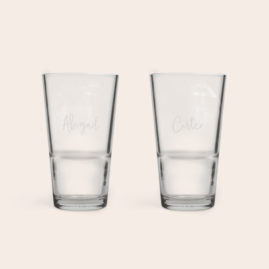Beer Glass 340 ml Two personalised half pint glasses, engraved with the names Abigail and Carter, perfect for any occasion.