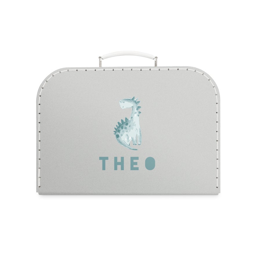 Maleta infantil personalizada Maleta de juguetes gris con dinosaurio azul, nombre "THEO" impreso y costuras decorativas personalizables.