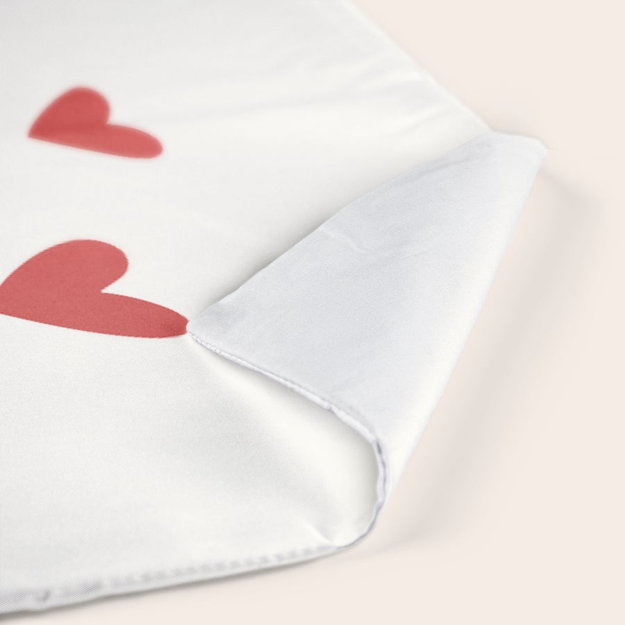 Personalised cushions & cushion cases Close up of a personalized cushion cover with printed red hearts, showing the soft fabric interior