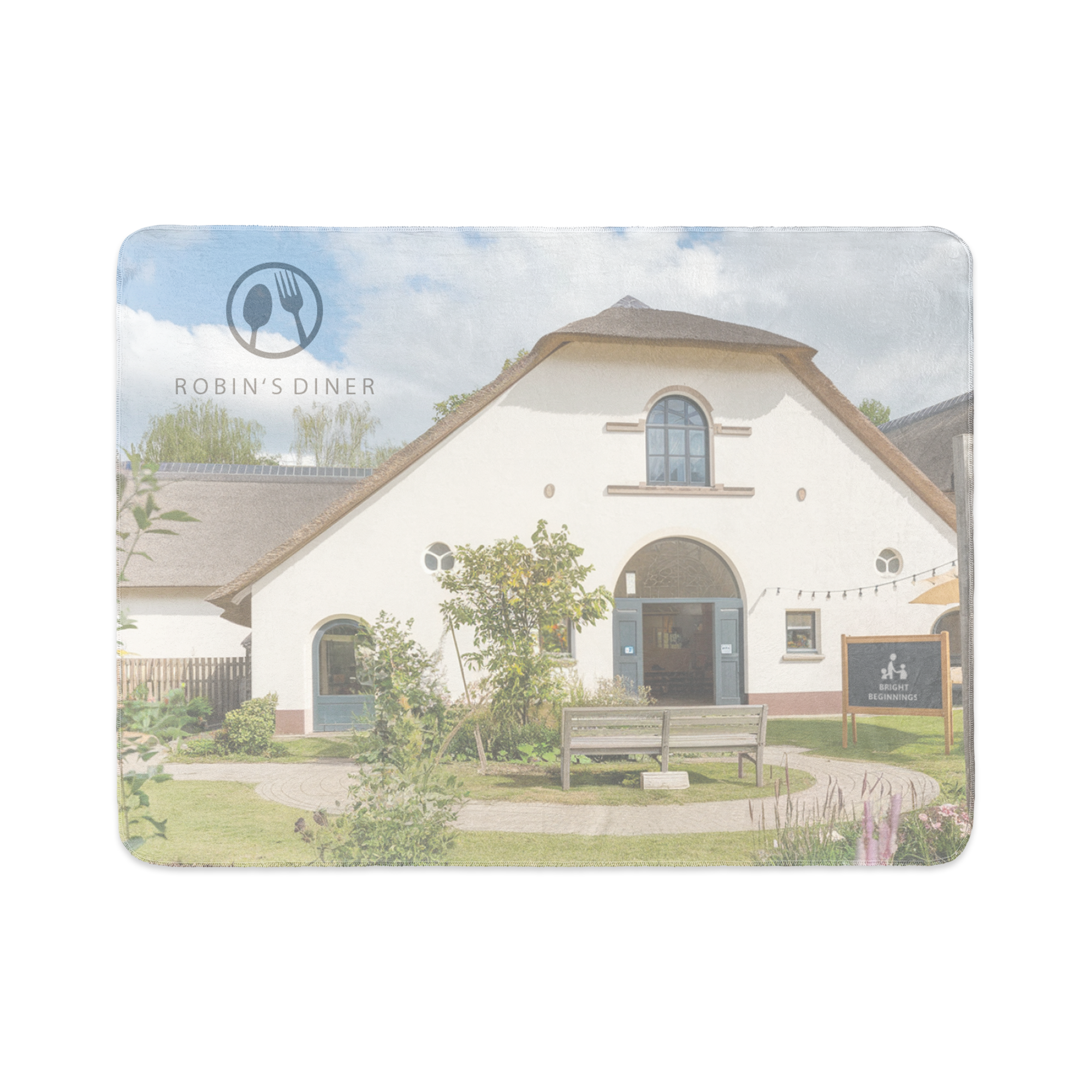 Fleece photo blanket printed with an image of Robin's Diner, a white building with a thatched roof.