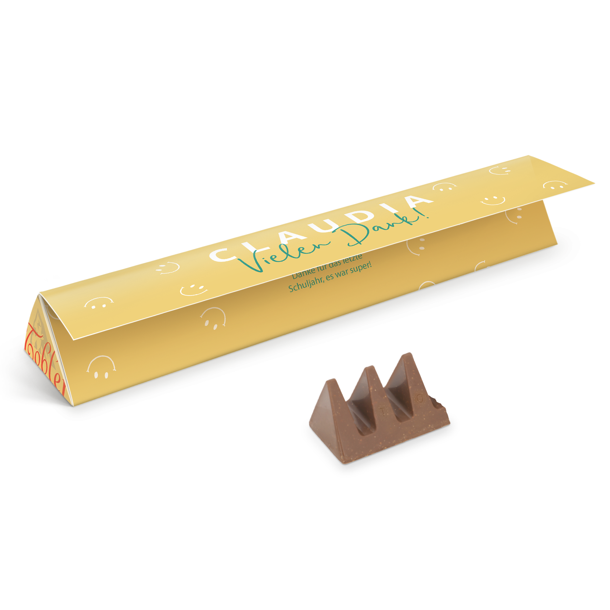 Personalisierte Toblerone Schokolade, bedruckt mit dem Namen Claudia und Vielen Dank, daneben ein Stück Schokolade.