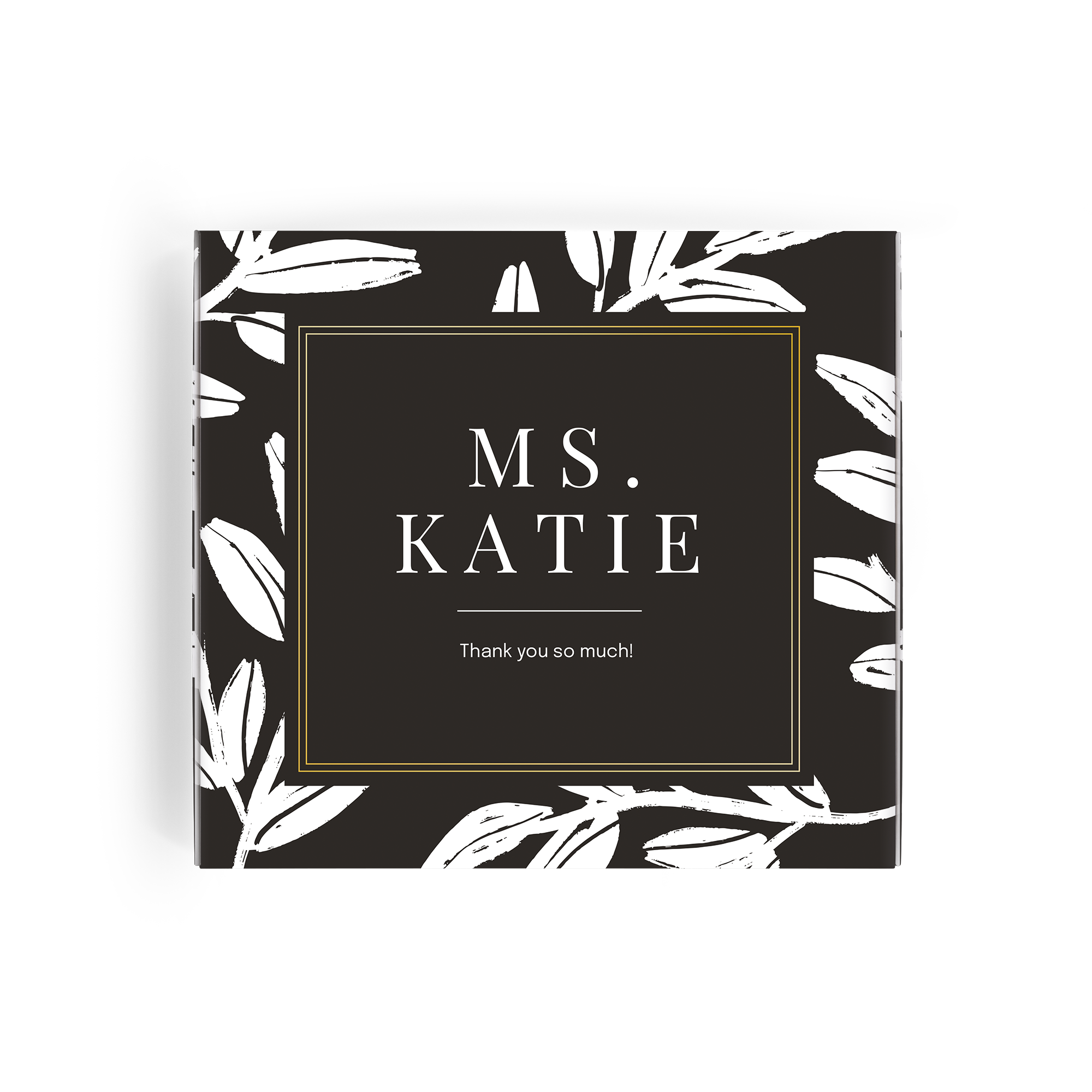 Caja regalo Milka personalizada para tu profesor, en negro con diseño de hojas blancas y texto Ms. Katie, Thank you so much! impreso.