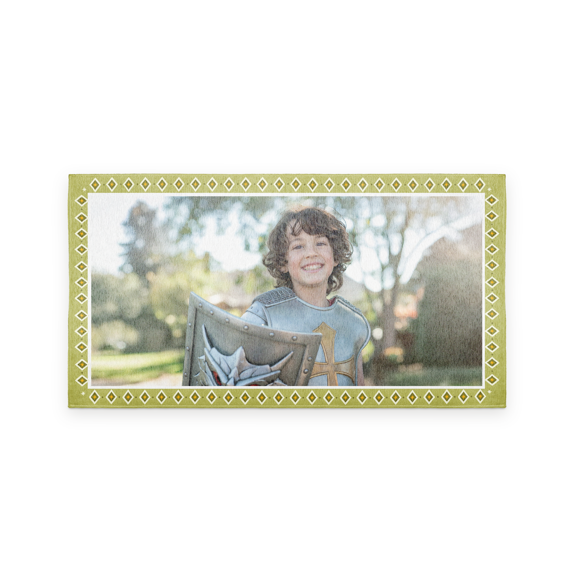 Personalised play mat - 150 x 80 cm, printed with a photo of a smiling child dressed as a knight holding a shield, bordered by a decorative green and white pattern.