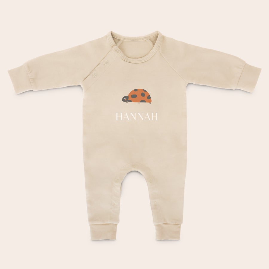 Baby Playsuit - Printed Beige personalised babygrow with a printed ladybug and the name Hannah, perfect for stretching and kicking those chubby legs