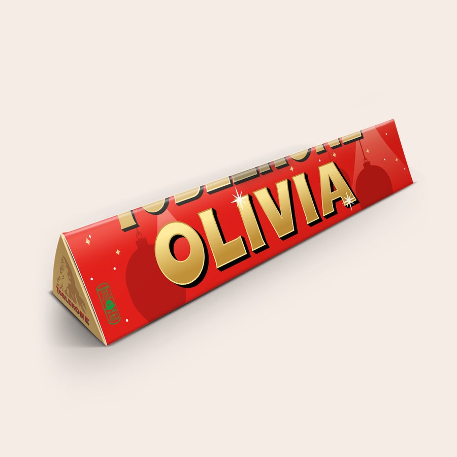 Toblerone-suklaa nimellä - Joulu Henkilökohtainen joulu-Toblerone-suklaapatukka, jossa vastaanottajan nimi Olivia on painettu kääreeseen.