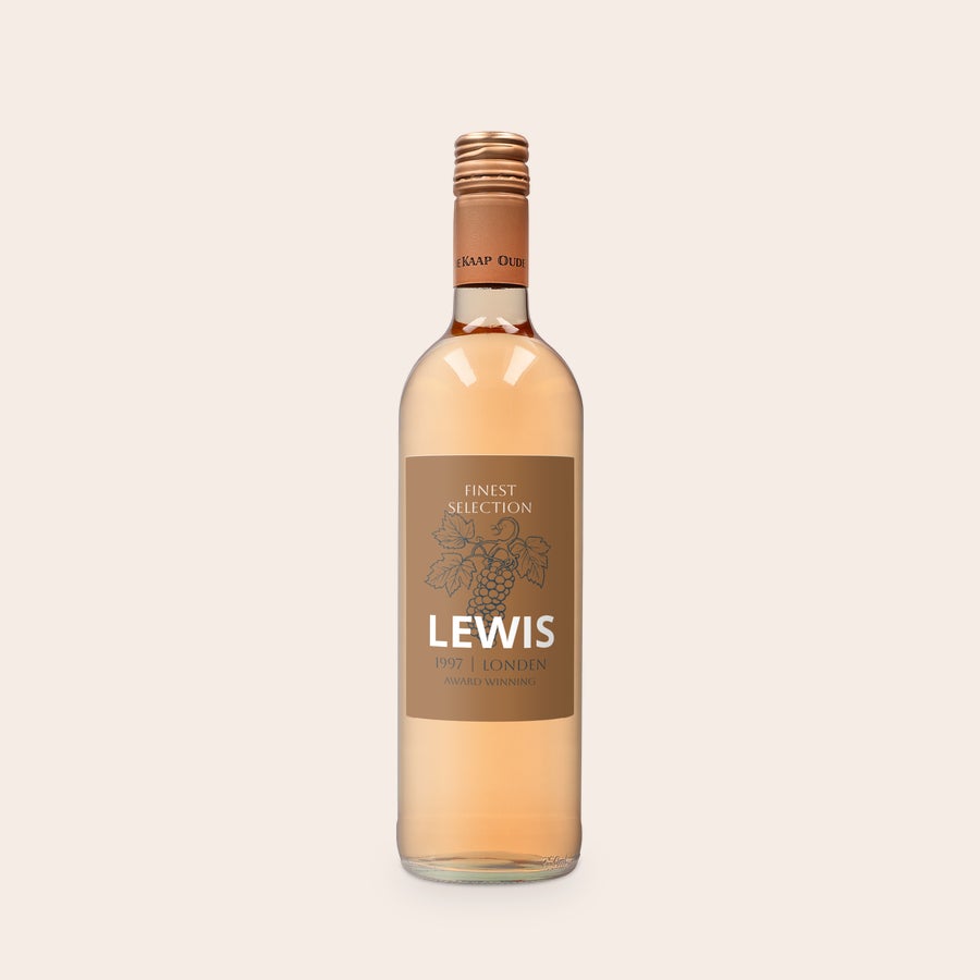 Personalizowane wino Oude Kaap Rosé Butelka Oude Kaap różowy z niestandardową etykietą, widocznym imieniem Lewis oraz rokiem 1997 i miastem London