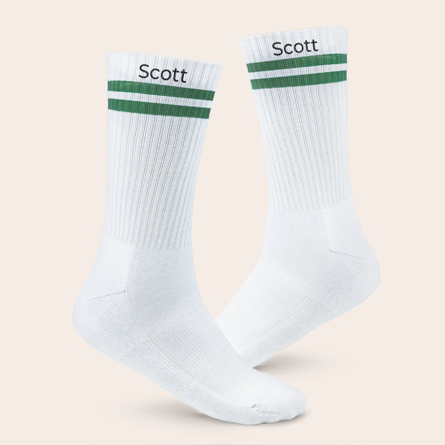 Sports socks with name White personalized sports socks with green stripes, printed with the name Scott