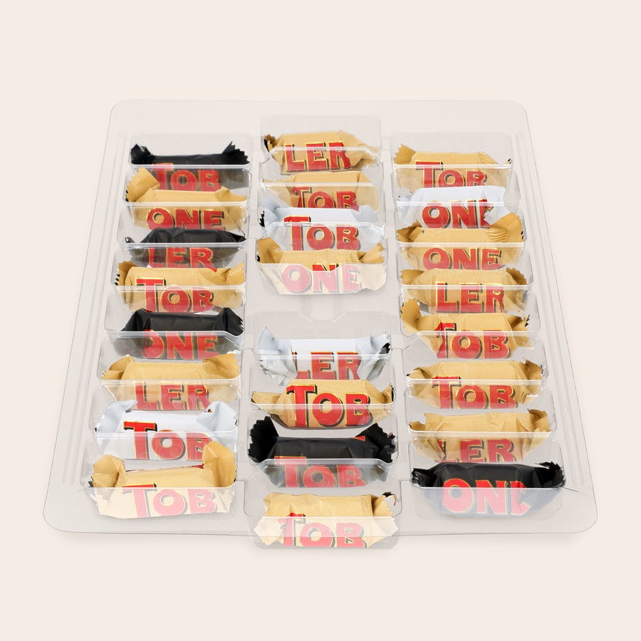 Adventskalender med bilde - Toblerone 2025 Toblerone adventskalender fylt med 24 sjokolader i ulike smaker, klar til å trykkes med personlig design.