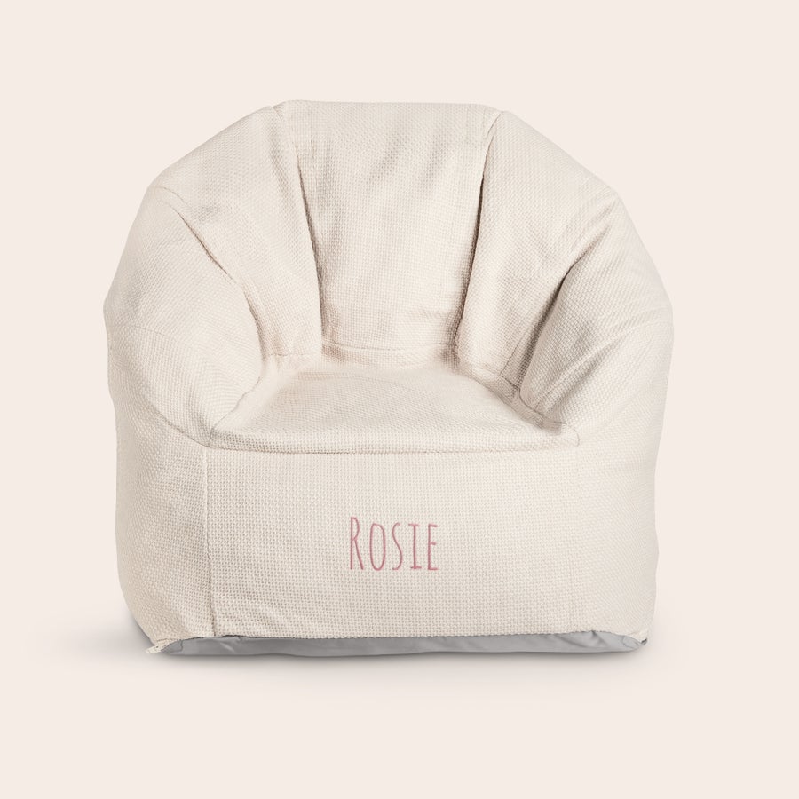 Embroidered children's chair Beige children's chair with the name ROSIE embroidered in pink on the front. What child wouldn't be happy with such a cool, trendy chair.