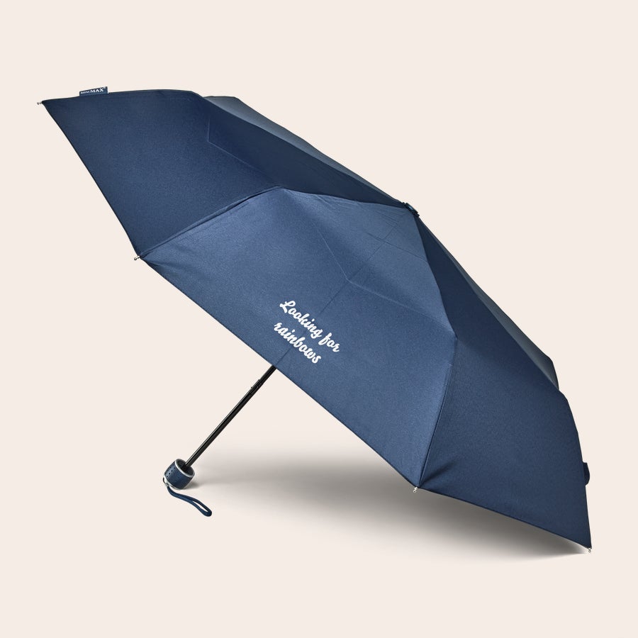 Printed Pocket Umbrella Navy blue personalized pocket umbrella printed with "Looking for rainbows" text