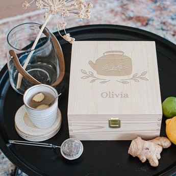 Wooden tea box with engraved lid