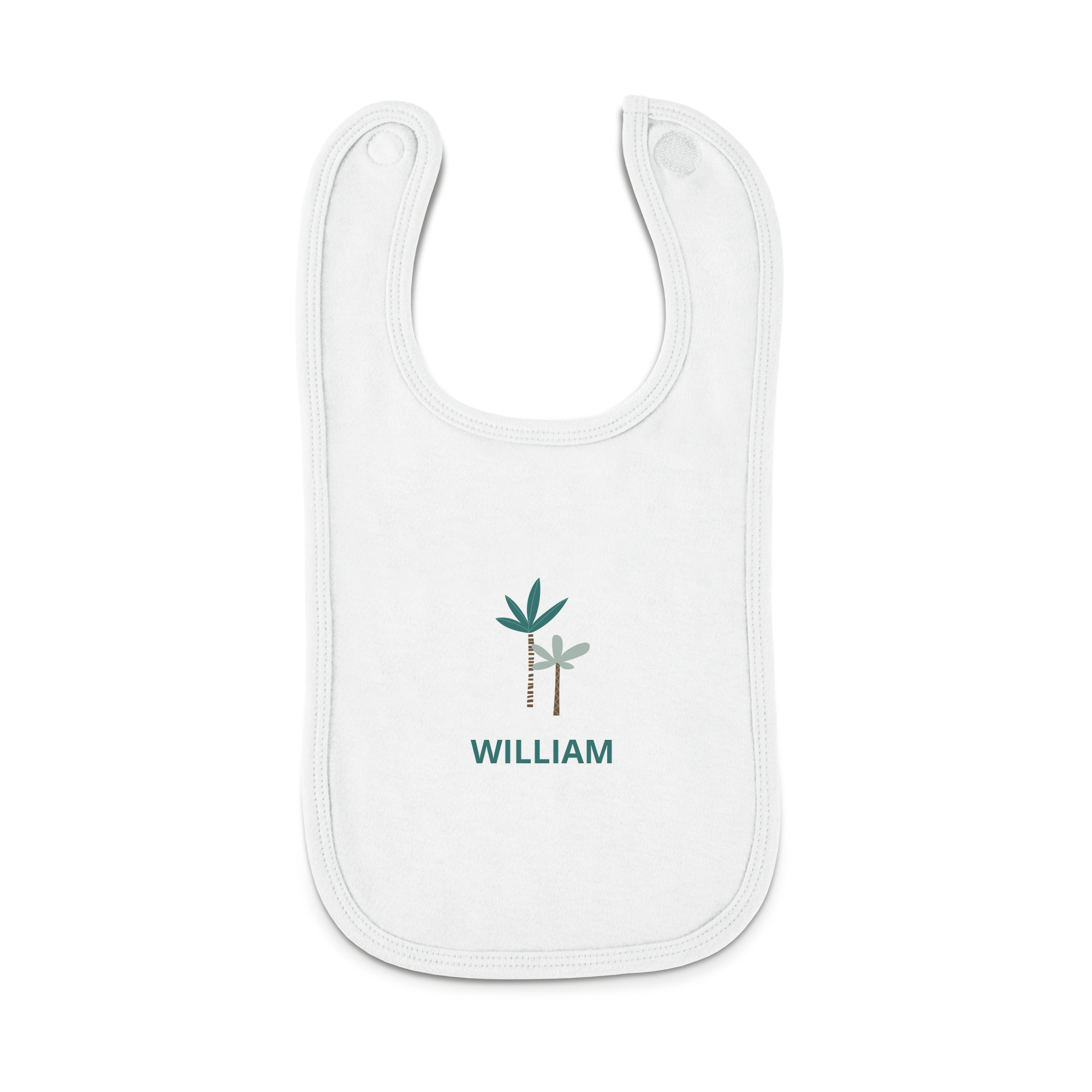 A personalised baby bib in white with a printed design of two palm trees and the name WILLIAM