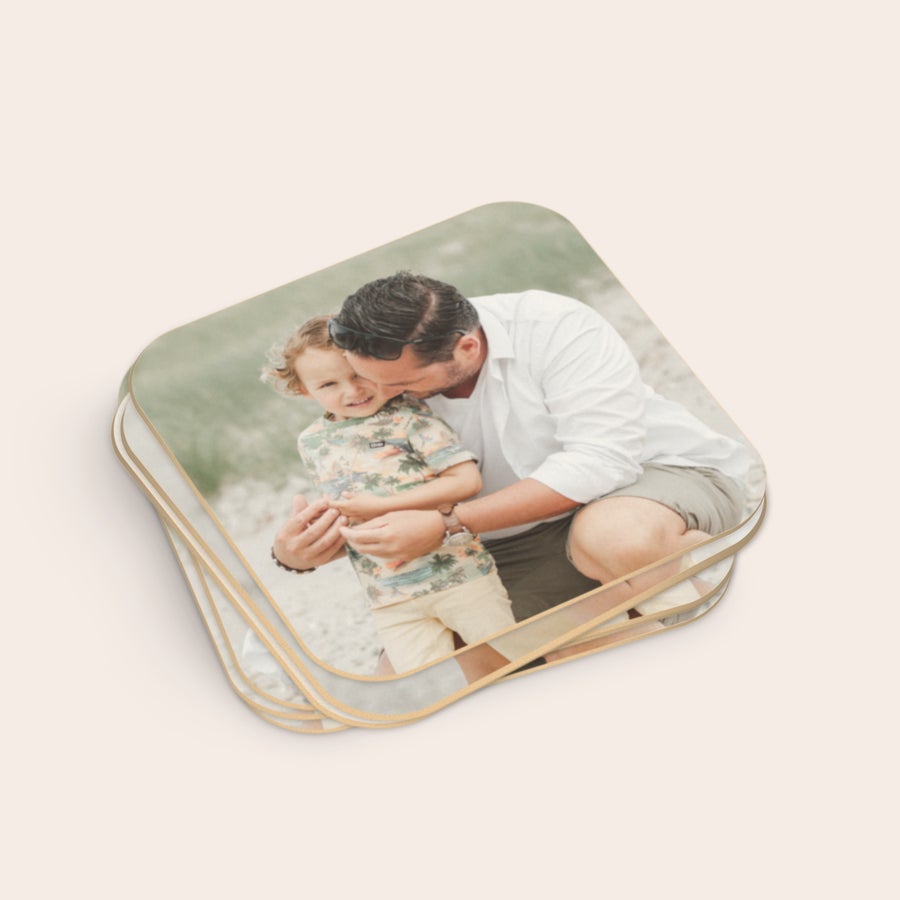 Personalised beer coasters A stack of personalised beer coasters printed with a photo of a man and a young boy