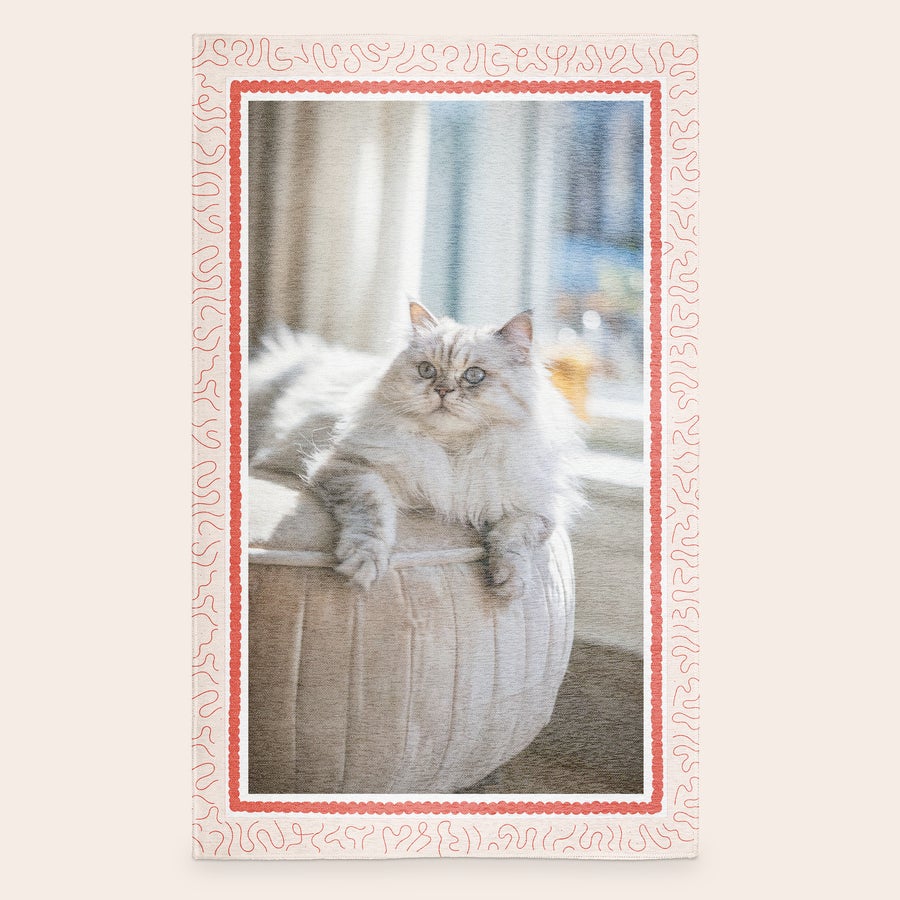 Printed rug Personalized rug printed with a fluffy cat photo in a red decorative border to feature your favourite memory