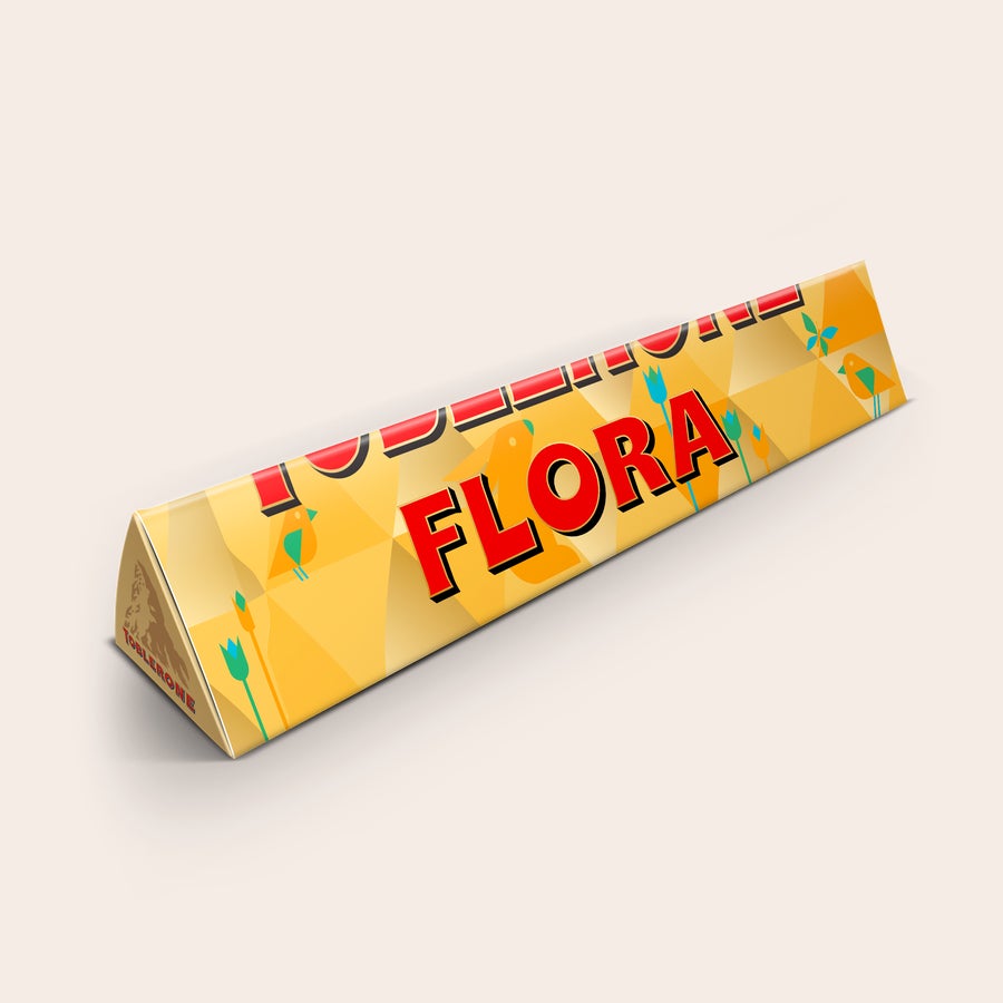 Toblerone Barra de chocolate Toblerone personalizada com embalagem amarela com "FLORA" impresso