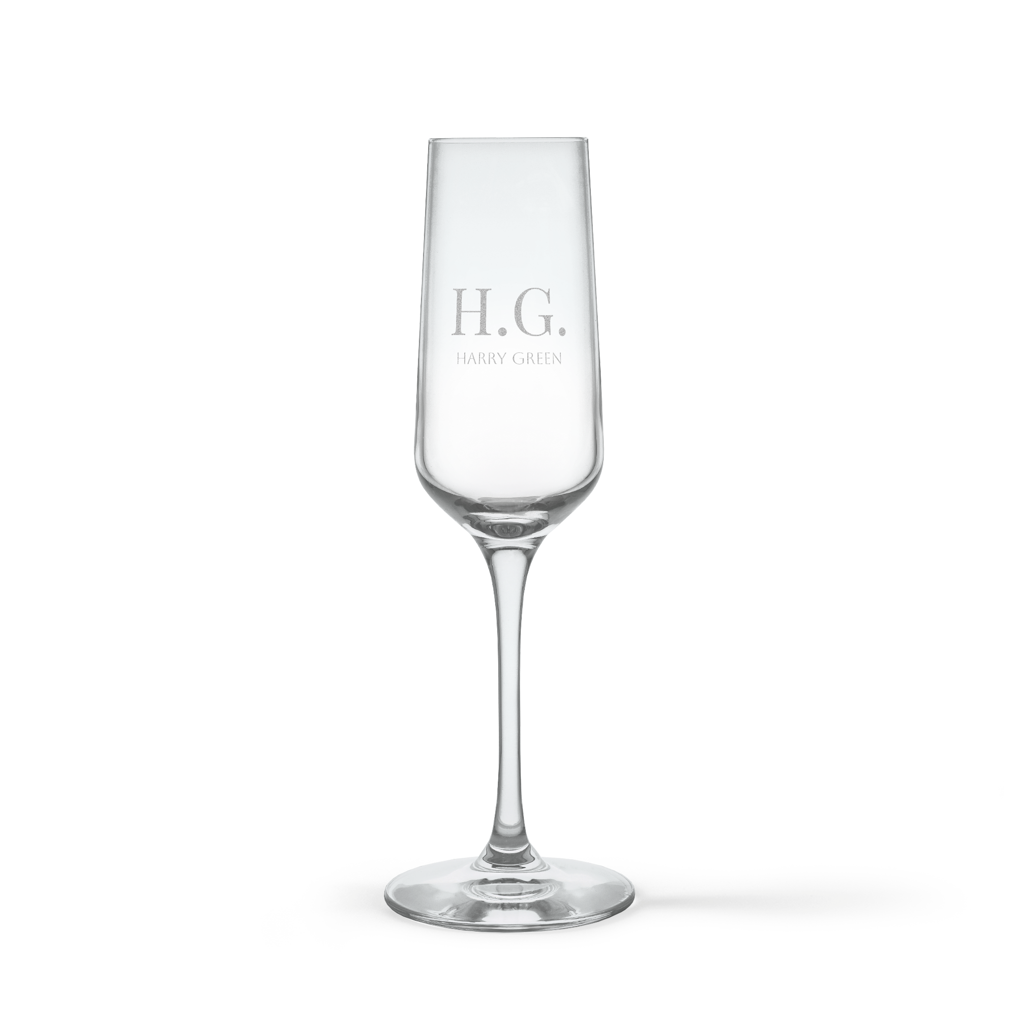 Personalised crystal champagne glass engraved with initials H.G. and the name Harry Green