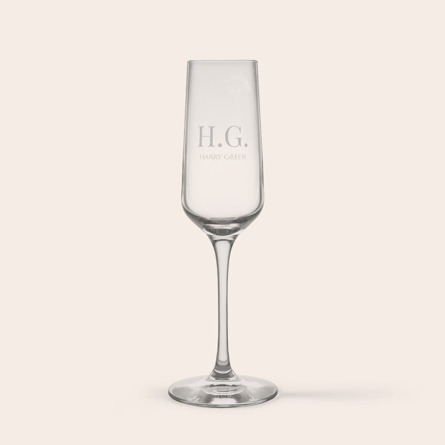 Personalised champagne glasses Personalised crystal champagne glass engraved with initials H.G. and the name Harry Green