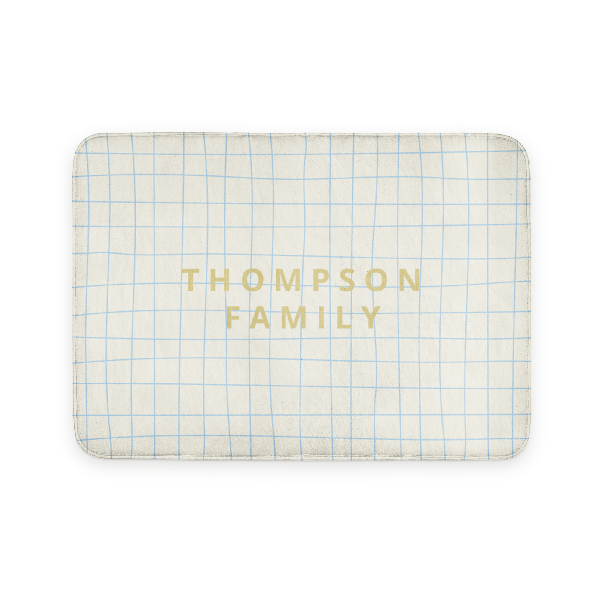 Alfombra de baño personalizada con diseño de cuadrícula azul y el texto "THOMPSON FAMILY" impreso.