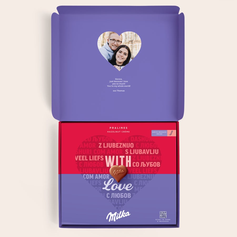 Milka Praline Ljubezen Personalizirana darilna škatlica Milka z natisnjeno fotografijo v obliki srca, osebnim sporočilom in čokoladnimi pralineji.