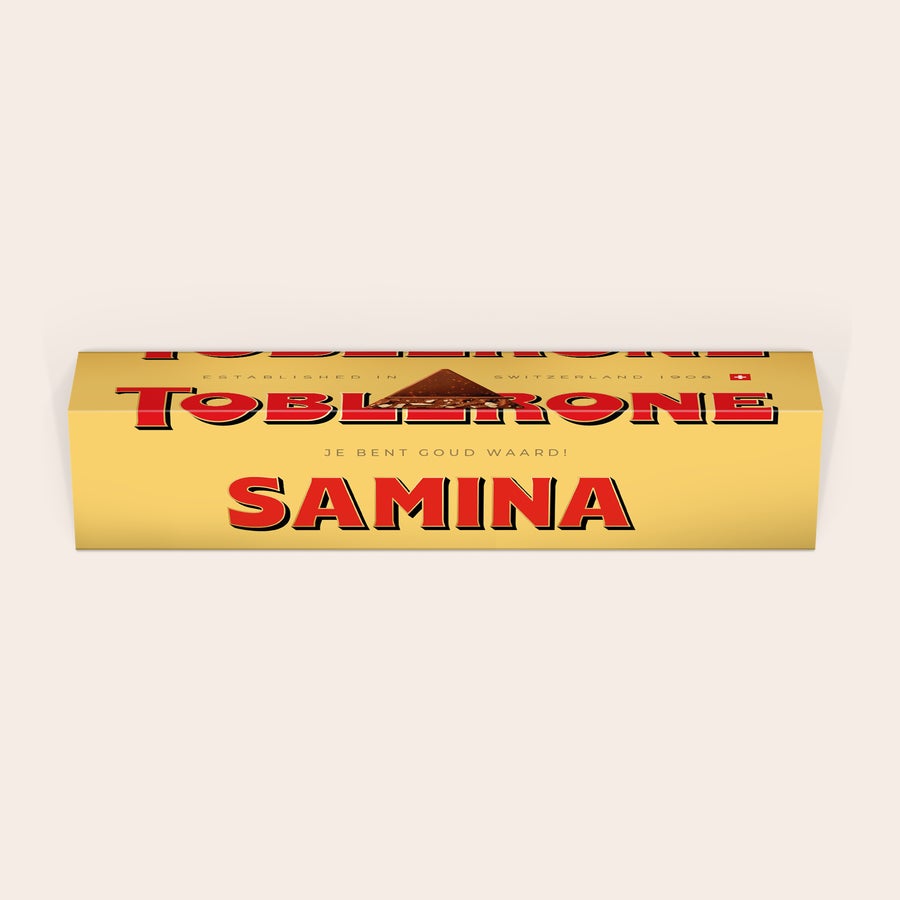 Toblerone met naam Toblerone reep met naam - 1800 gram, gepersonaliseerd met de naam SAMINA in rode letters en de tekst